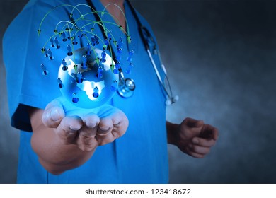 Medical Doctor Holding A World Globe In Her Hands