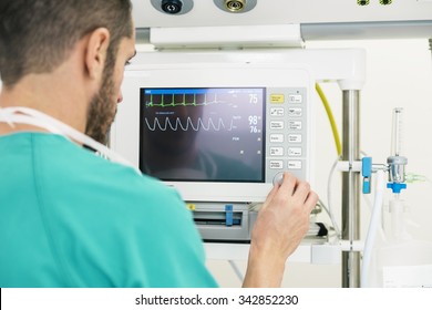 Medical Doctor Making ECG Test In Hospital. Medical Concept