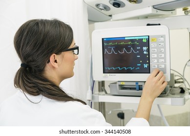 Medical Doctor Making ECG Test In Hospital. Medical Concept