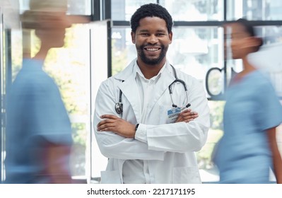 Medical Doctor, Man Nurse And Crossed Arms Healthcare Professional In Busy Hospital. Portrait, Happy Face Expression And Health Wellness Clinic Worker Or Surgery Consultant Employee In Uniform