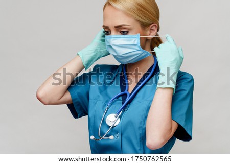 medical doctor nurse woman with stethoscope wearing protective mask and rubber or latex gloves