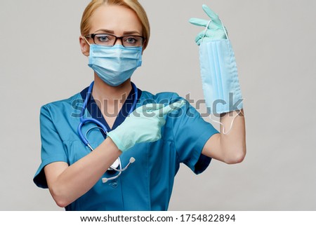 medical doctor nurse woman with stethoscope wearing protective mask and rubber or latex gloves