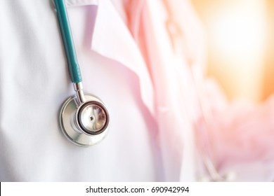 Medical doctor or physician in white gown uniform with stethoscope in hospital or clinic