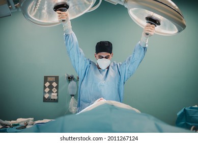Medical doctor preparing to perform surgery inside emergency hospital room - Focus on face - Shutterstock ID 2011267124
