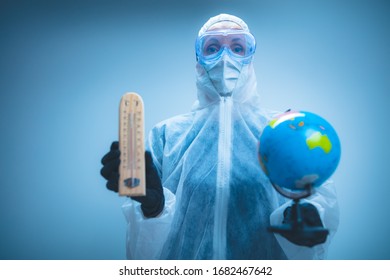 Medical Doctor And Scientist Holding Earth Globe For Presenting Virus Pandemic Outbreak On The Whole Planet. Global Warming And Temperature Rising Presentation.