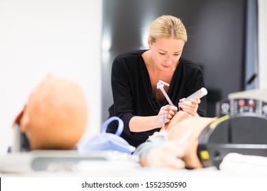 Medical Doctor Specialist Expert Displaying Method Of Patient Intubation Technique On Hands On Medical Education Training And Workshop.