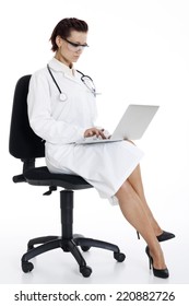 Medical Doctor Woman With Stethoscope And Laptop. Isolated Over White Background