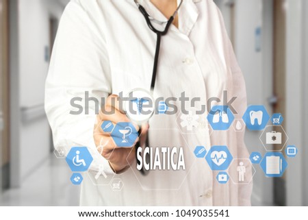 Medical Doctor  and words SCIATICA  in Medical network connection on the virtual screen on hospital background. 