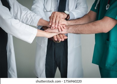 Medical Doctors Team Stacking Their Hands Together, Closeup Of Professional Physician Doctor Join Hand For Unity And Support Togetherness In Hospital. Medicine Healthcare/Collaboration Union Concept