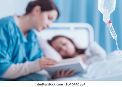 Medical Drip On Blurred Background With Mother And Her Sick Kid