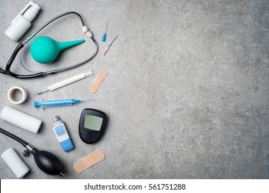 Medical Equipment On Gray Stone Background.