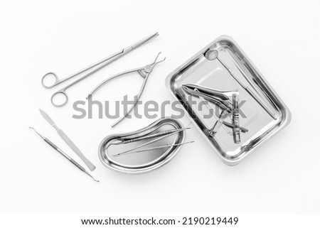Medical equipment tools instruments in steel tray at doctor desk