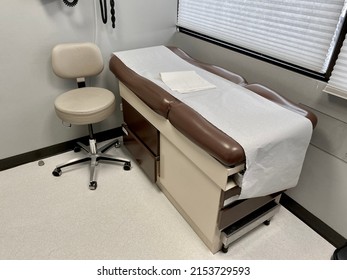 A Medical Exam Table Of A Health Care Facility At A Doctor Clinic 