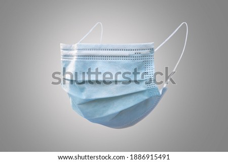 Medical face mask isolated with clipping path on grey background  (side view) for covid-19, coronavirus, virus infection prevention and hygience safety protection for doctor and surgical staff