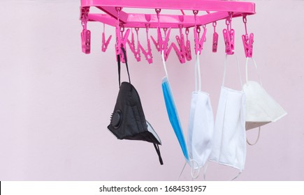 Medical Face Masks Are Hanging Out To Dry Using Pegged Clothesline For Reuse Because Of Limited Availability,Cleaning Of Medical Masks That Are Clean And Hanging, Dry, Sterilized For Reuse 