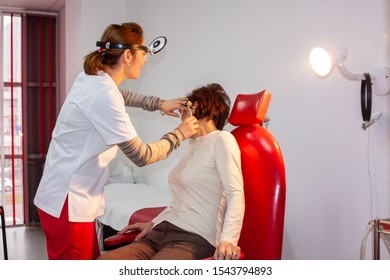 Medical Facility, Doctor Checking Vital Signs  On The Female Patient