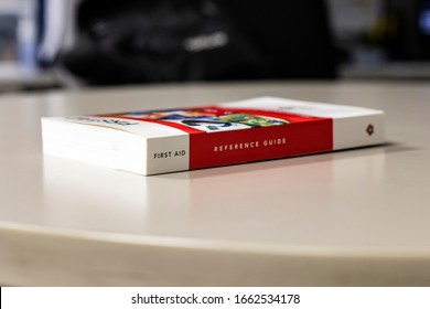 MEDICAL FIRST AID REFERENCE GUIDE BOOK Placed On Table. First Aid Reference Guide.