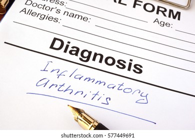           Medical Form With Diagnosis Inflammatory Arthritis On A Table.                     