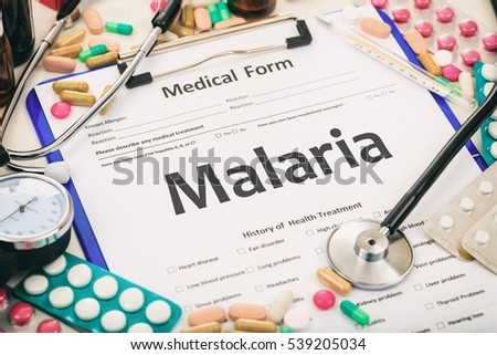 Medical form on a table, diagnosis malaria