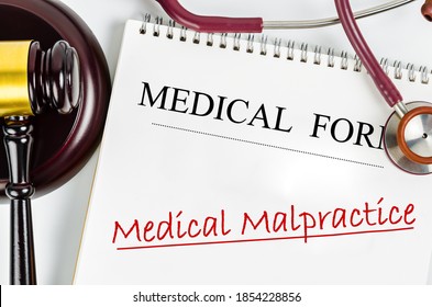 Medical Form With Words Medical Malpractice And Judge's Hammer Gavel And Stethoscope Medical. Medical Malpractice Law Concept.