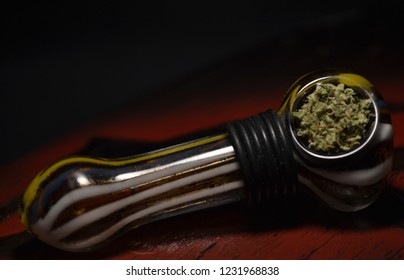 Medical Grade Cannabis Packed Into Glass Pipe