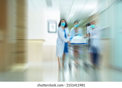 Medical Health Care Emergency Department Concept , Blurred Image Of  Medical Team Pushing Stretcher Injured Patient  Seriously  Towards To Operating Room 