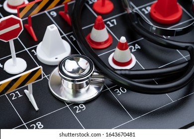 Medical Health Check Schedule Or Reserve Health Time Management Concept, Doctor Stethoscope With Busy Black Calendar With Full Of Traffic  Signs Such As Red Pylons, No Entry And No Parking.