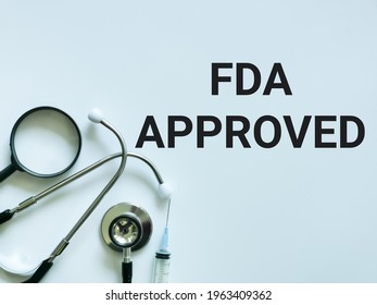 Medical and Health concept. Phrase FDA Approved written on white background with stethoscope.