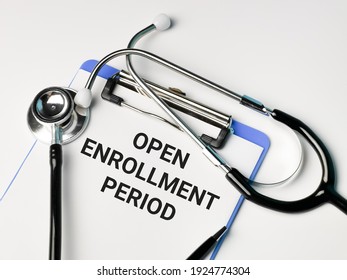 Medical And Health Concept. Phrase OPEN ENROLLMENT PERIOD Written On Paper Clipboard With Stethoscope And A Pen. 