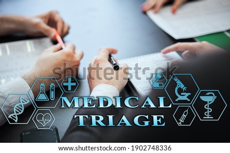 Medical healthcare concept - group of doctors in hospital with digital medical icons, graphic banner showing symbol of medicine, providing medical care. The inscription 'MEDICAL TRIAGE'  Foto stock © 