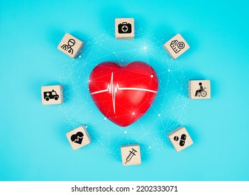 Medical Healthcare Concept - Red Heart With Medical Icons On A Wooden Cube, Medical Care People, Emergency Service Network, Doctor Data Of Patient Health.                           