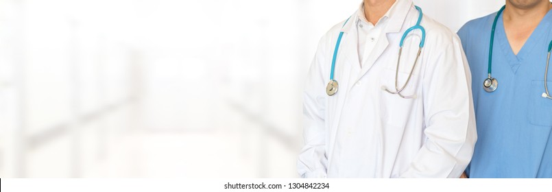 Medical Healthcare Doctor Team Concept. Physicians In White Gown And Stethoscope, Hand Holding Computer Tablet On Blur Background Corridor Hospital For Copy Space.