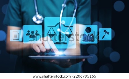 Medical healthcare pharmaceutical compliance law regulations and policies concept, female doctor holding tablet technology graphical showing law icon pharmacy healthcare contract rules human rights