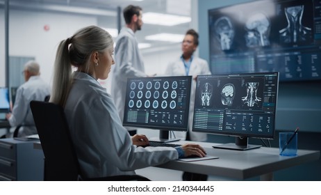Medical Hospital Health Care Lab: Portrait of Female Medical Scientist Using Computer with Brain Scan MRI Images, Finding Cure. Professional Neurologist Analysing CT Scan Finding Cure for Sick Patient - Shutterstock ID 2140344445