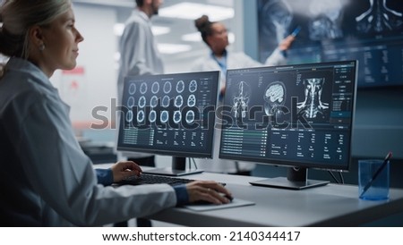 Medical Hospital Health Care Lab: Portrait of Female Medical Scientist Using Computer with Brain Scan MRI Images, Finding Cure. Professional Neurologist Analysing CT Scan Finding Cure for Sick Patient