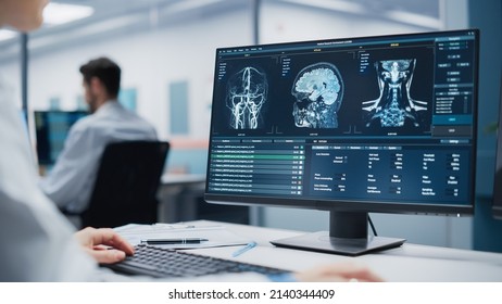 Medical Hospital Research Lab: Caucasian Female Neurosurgeon Using Computer With Brain Scan MRI Images, Finding Best Treatment For Sick Patient. Professional Neurologist Is Using CT Scan