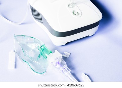 Medical inhaler, nebulizer, nebular. Respiratory medicine. Asthma breathing treatment. Bronchitis, asthmatic health equipment. Illness care - Shutterstock ID 410607625