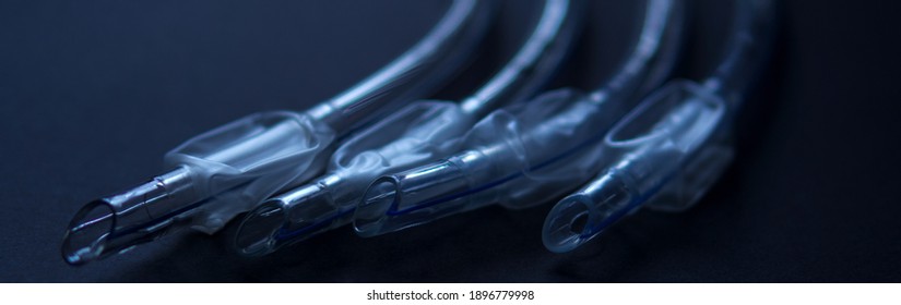 medical instruments. endotracheal tubes of different sizes, shot close-up on a black background