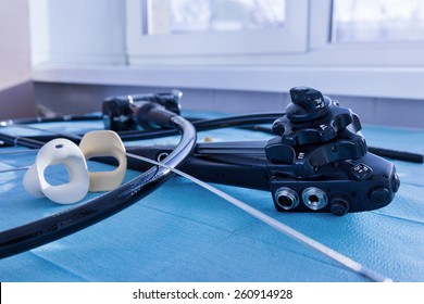 Medical instruments, gastroscopy. Endoscope close-up on a blue background.