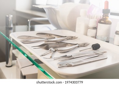 Medical Instruments On A White Tray. Chiropody Tools. Nail Nippers And Nail Rasps.