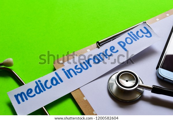 Medical insurance policy on Healthcare concept\
with green background