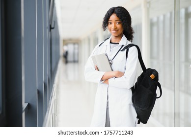 Medical Internship Concept. Portrait Of Young Black Female Doctor Student In White Coat.