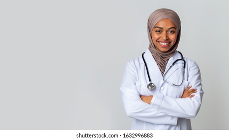 Medical Internship For Islamic People. Portrait Of Happy Black Muslim Female Doctor Student In Hijab And White Coat Over Light Background, Panorama