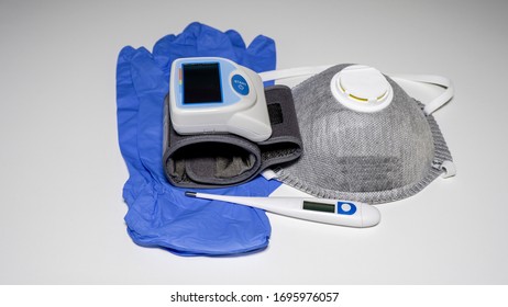 Medical Kit: Digital Body Thermometer For Body Temperature, FFP2 Face Medical Mask And Arm Blood Pressure Monitor. Disposable Medical Gloves. Kit To Be Used To Check Values During Coronavirus Covid19