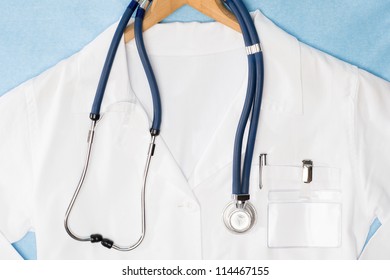 Medical Lab Coat And Stethoscope Hanging On Hanger