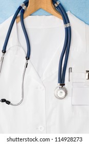 Medical Lab Coat And Stethoscope Hanging On Hanger