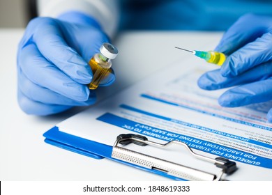 Medical Lab Worker Holding Syringe And Vial Ampoule,closeup Of Hands In Blue Latex Protective Gloves,Coronavirus Convalescent Patient Platelet Rich Blood Plasma Transfusion Therapy,vaccination Concept