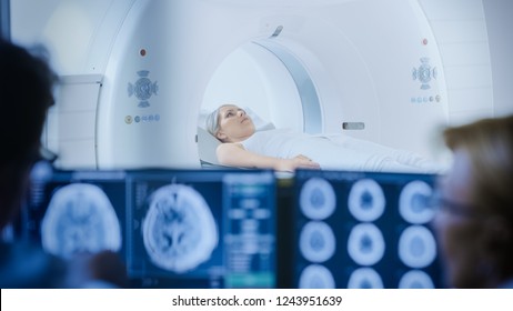 In Medical Laboratory Patient Undergoes MRI or CT Scan Process under Supervision of Doctor and Radiologist in Control Room, They Watche Procedure and Monitors Brain Activity Results. - Powered by Shutterstock