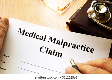 Medical Malpractice Claim On A Table.