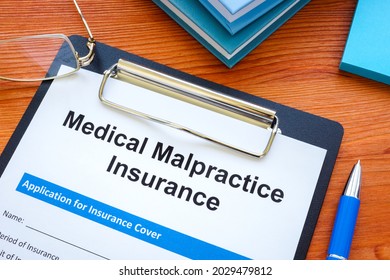 Medical Malpractice Insurance Application And Clipboard.